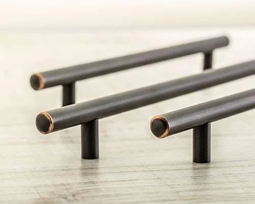 Ручка рейлинговая античная медь на темном фоне.... Темное изображение ручки рейлинговой античной меди